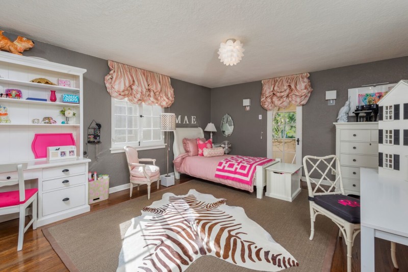 girl\'s bedroom with faux zebra print rug on floor