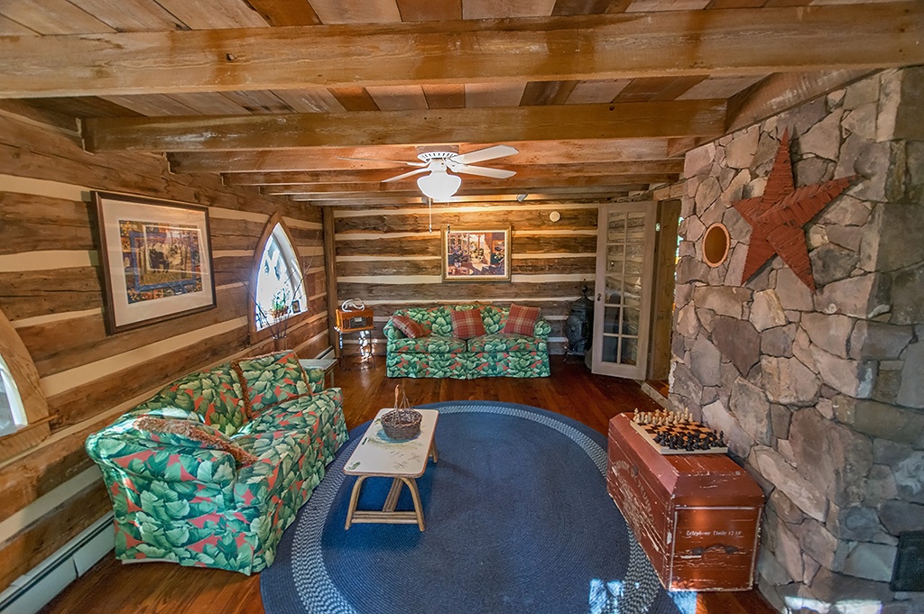 A living room filled with furniture and a fire place