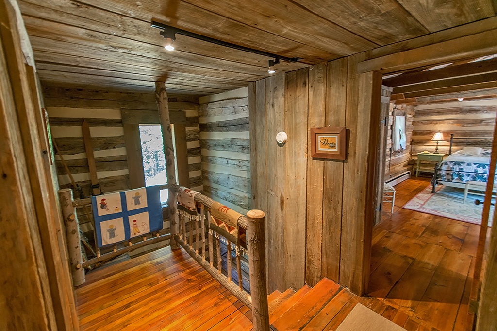 Second floor landing with rustic railing