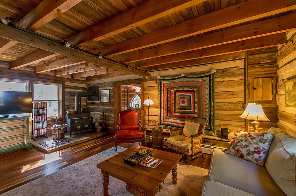 Living room in log home with wood burning stove