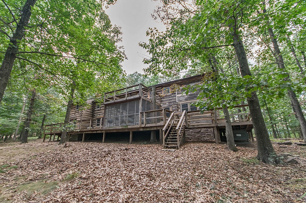 back exterior of two story log home