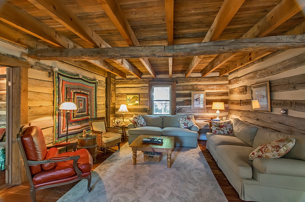 Living room with wood walls and ceiling