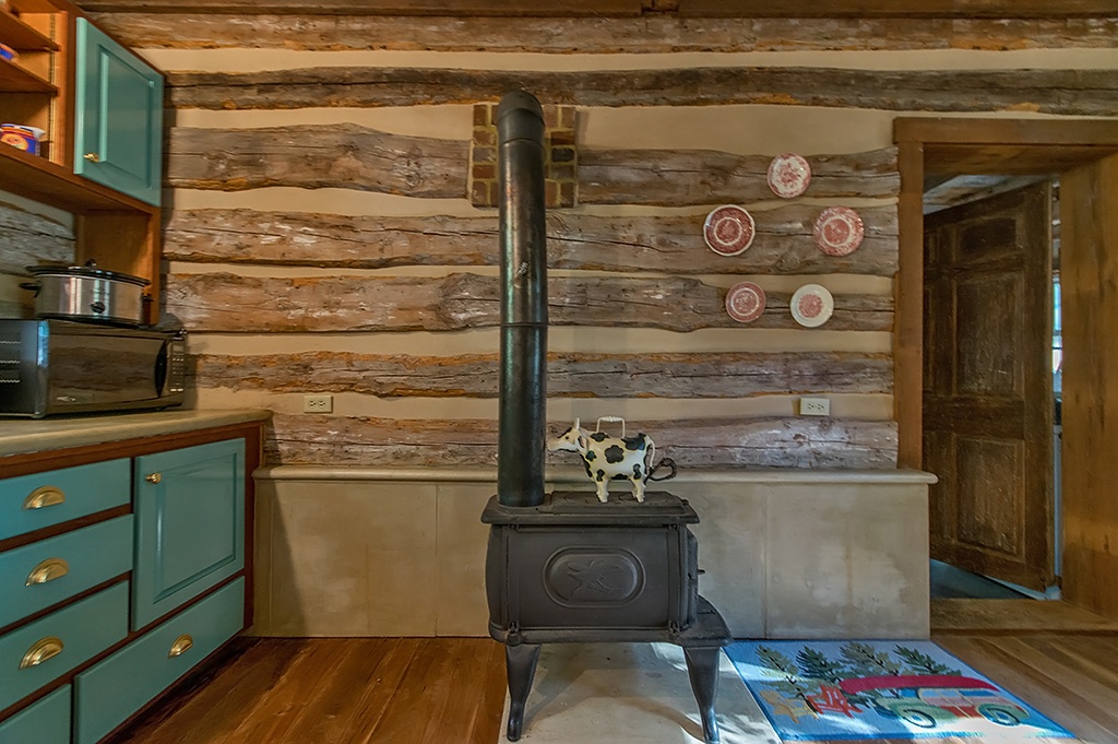 wood burning stove in log cabin