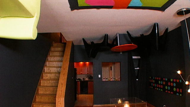 black basement with furniture on ceiling