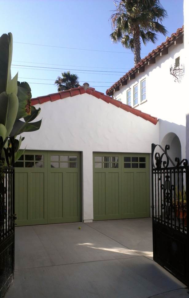 garage with green garage doors