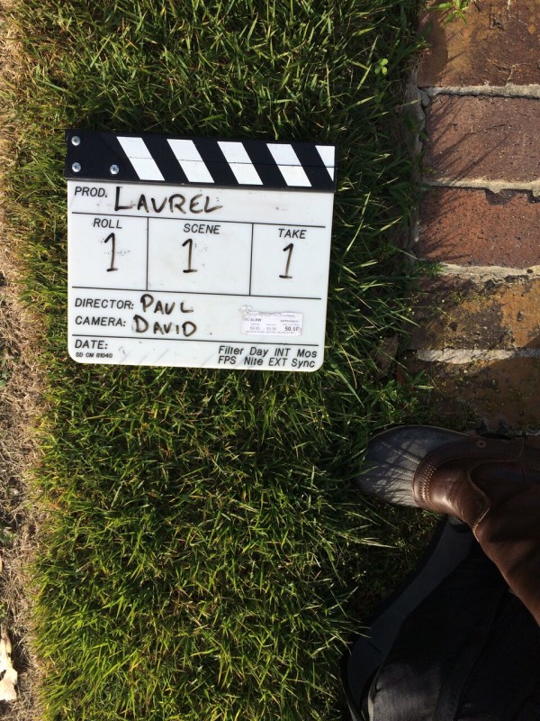 A production sign on the grass that says Laurel on it