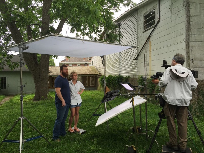 Erin and Ben Napier filming scene in the yard