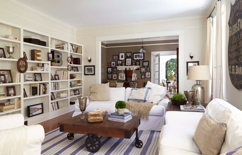Ben and Erin\'s living room with built-in bookshelves and white sofa