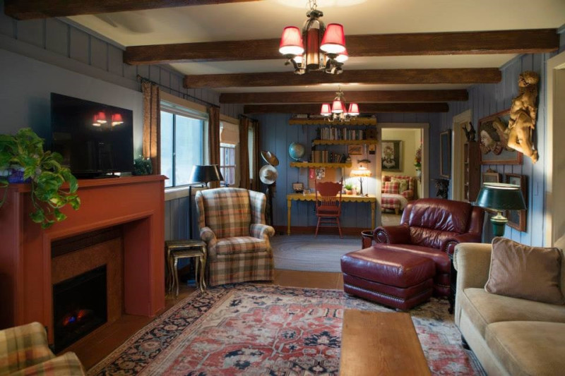 A living room filled with furniture and a fire place