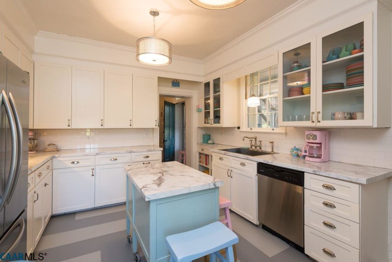 White kitchen with pale blue island