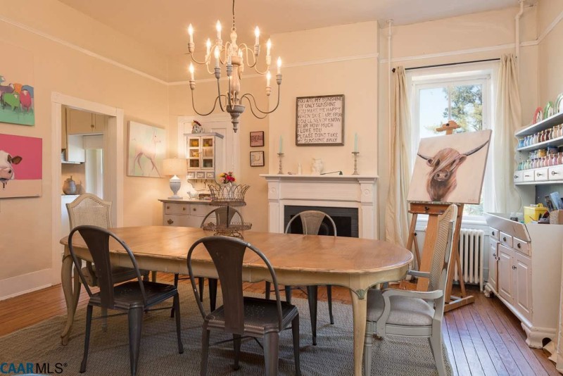 Dining room with fireplace and large chandelier