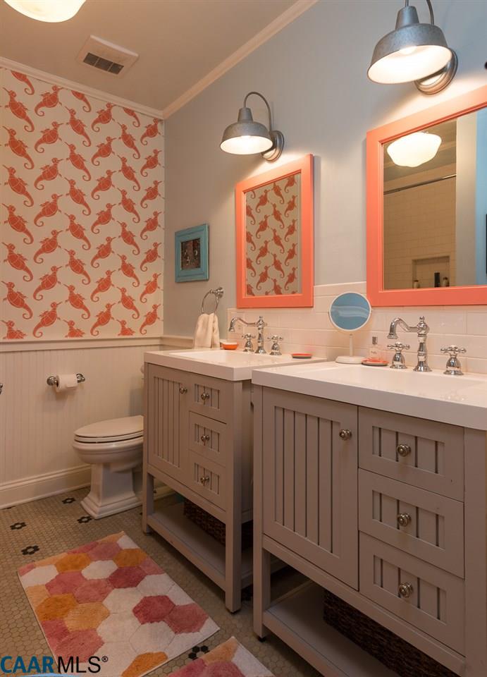 Bathroom with two vanities and sinks