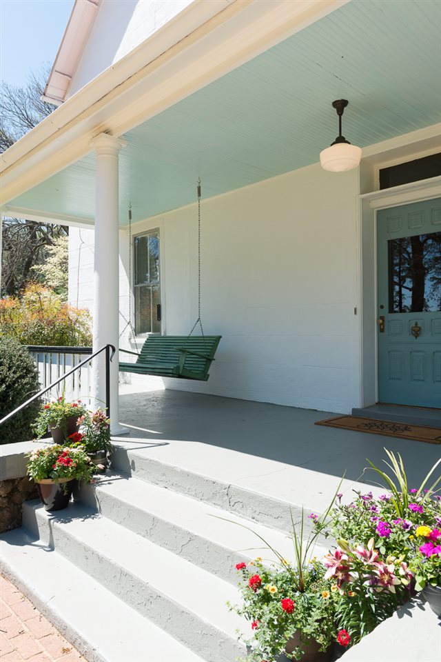 Front porch with swing and pale blue painted ceiling