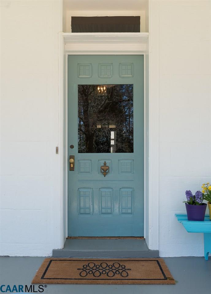 Closeup of aqua blue front door on farmhouse