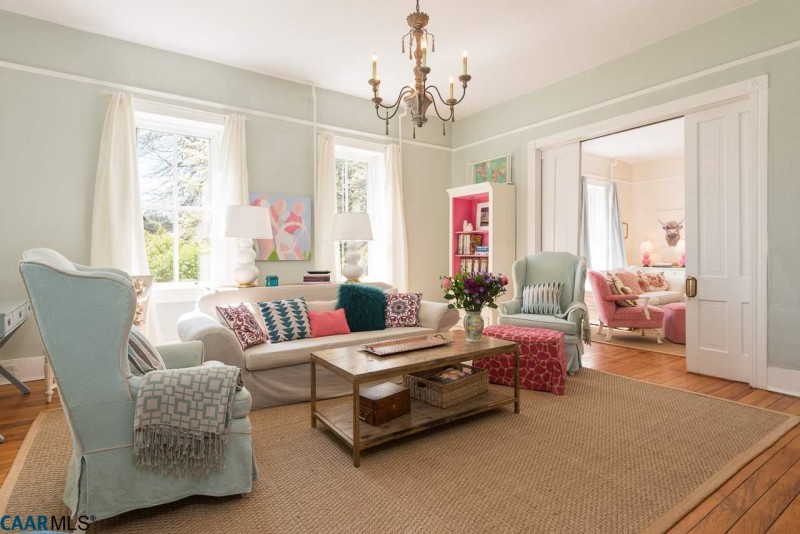 A living room filled with furniture and a large window