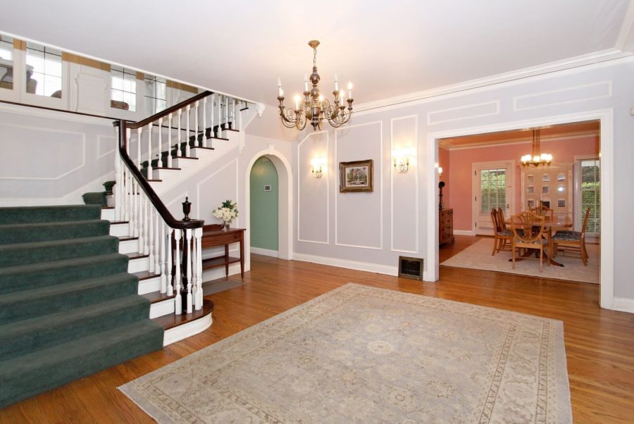 Entry hall and staircase with chandelier