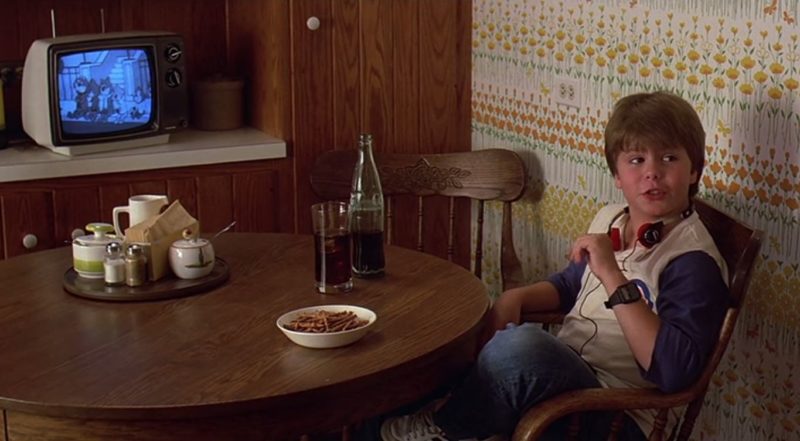 A boy sitting at the kitchen table