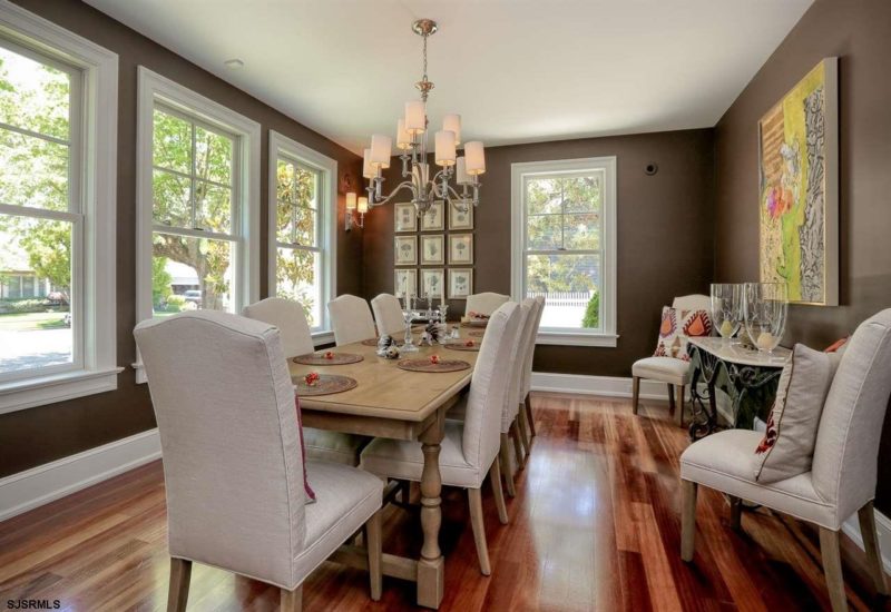 Dining room table and chairs with dark brown walls