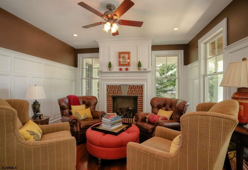 A living room filled with furniture and a fire place