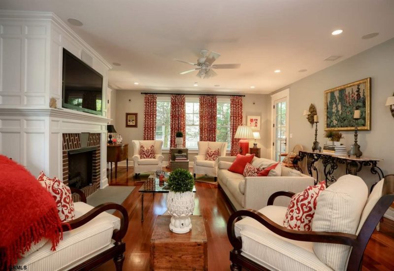 A living room filled with furniture and a fire place