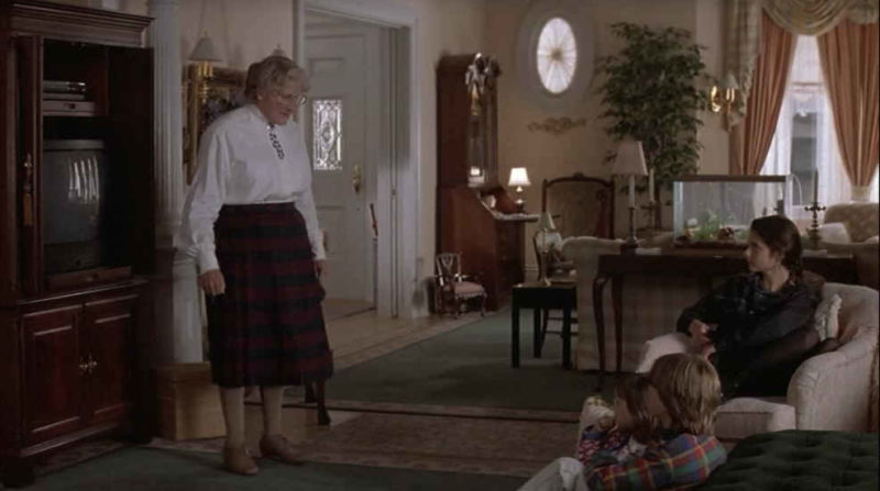 Mrs. Doubtfire standing in the living room