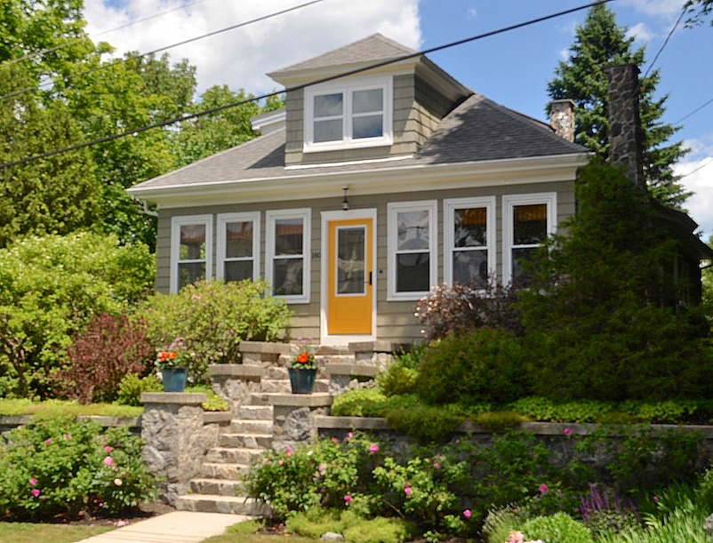 Remodeled bungalow in Portland, Maine, with yellow door