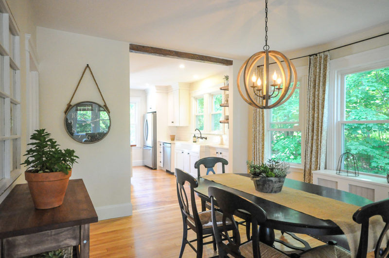 A dining room table in front of a window