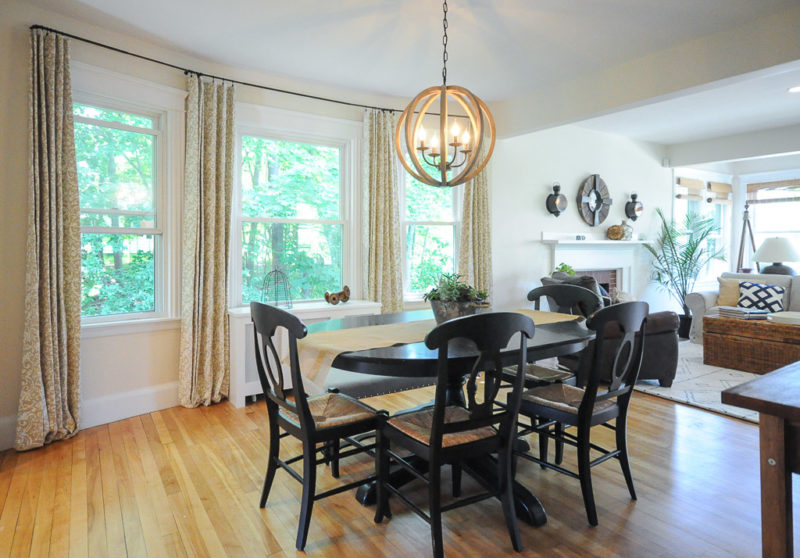 A dining room table in front of a window