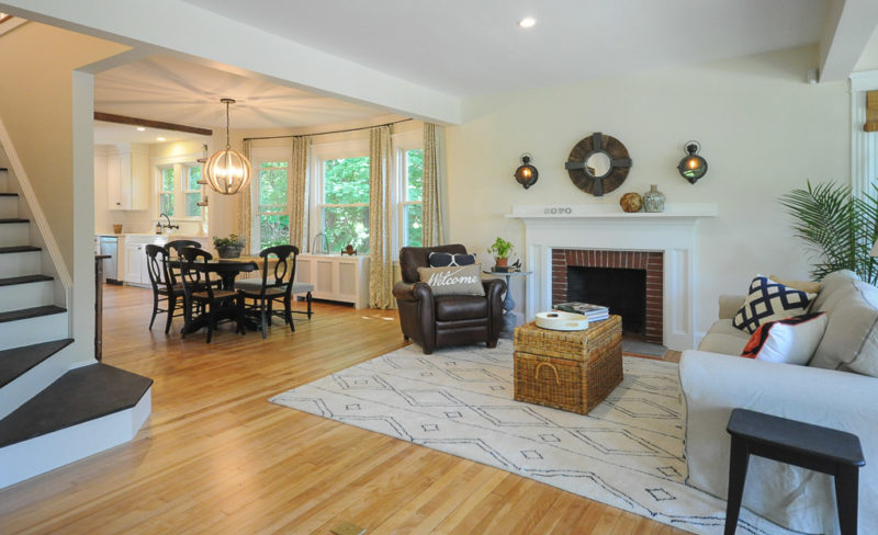 A living room filled with furniture and a fire place