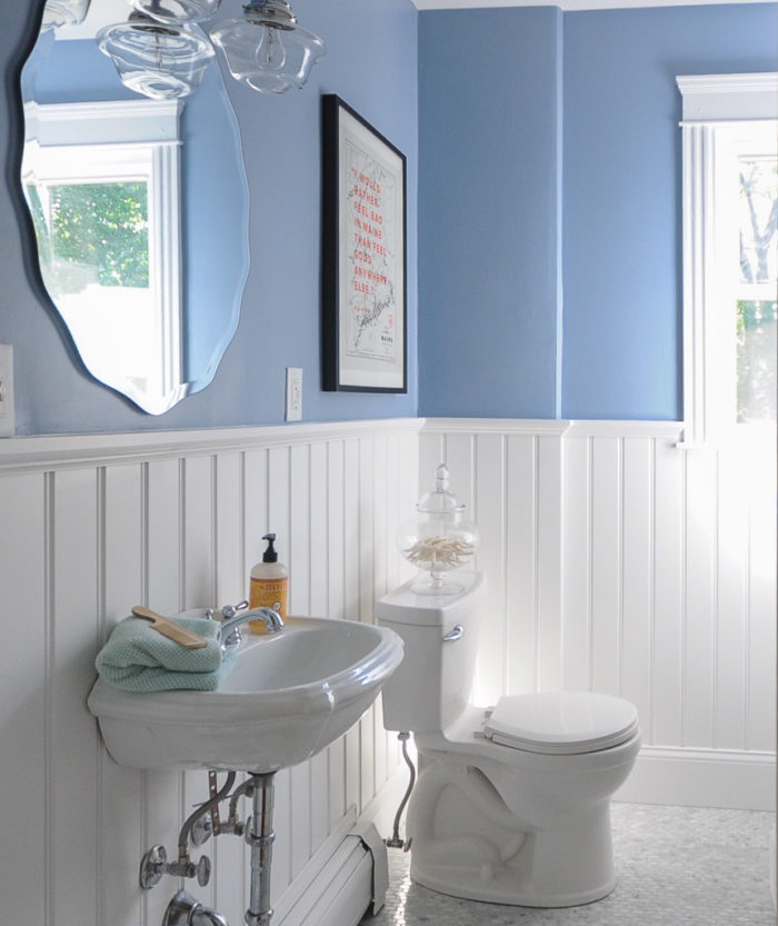 A blue bathroom with beadboard