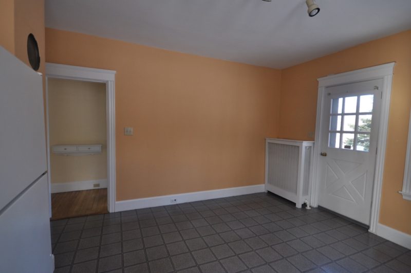 A kitchen with a tiled floor