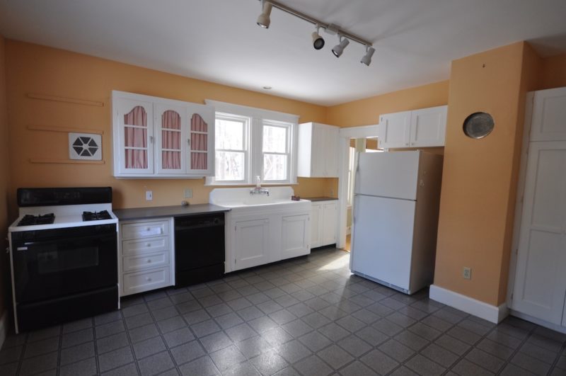 Kitchen with tile floor and old appliances before remodel