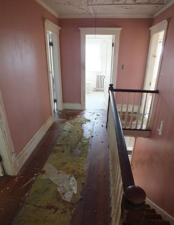 Upstairs landing with pink walls before remodel