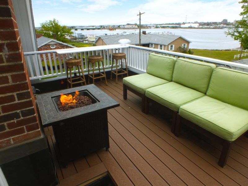 Balcony with fire pit and outdoor furniture