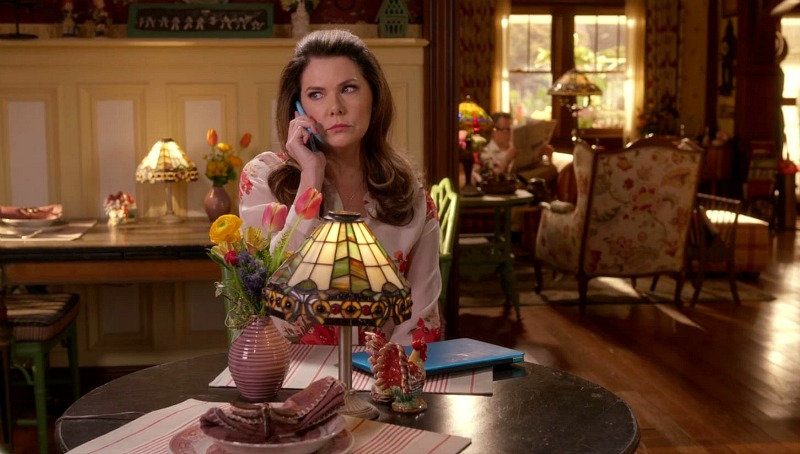 Lauren Graham sitting at a dining table at the Dragonfly Inn