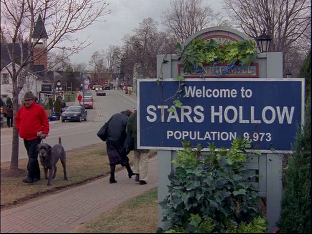 Sign saying Welcome to Stars Hollow Population 9,973