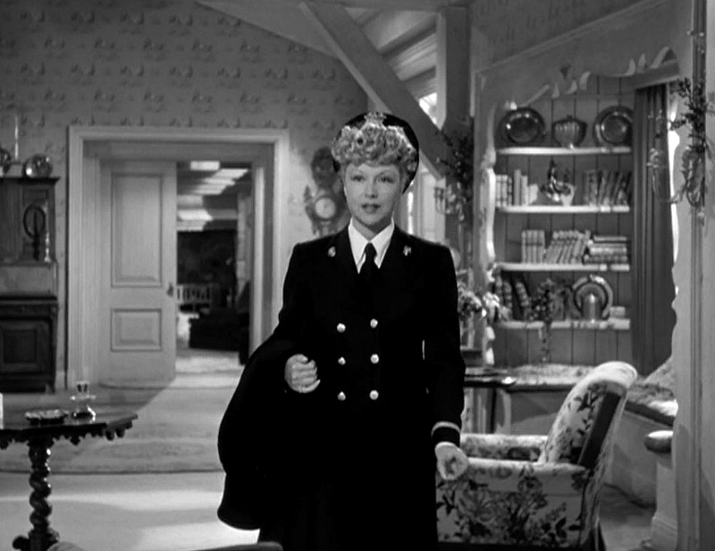 Joyce Compton enters the living room