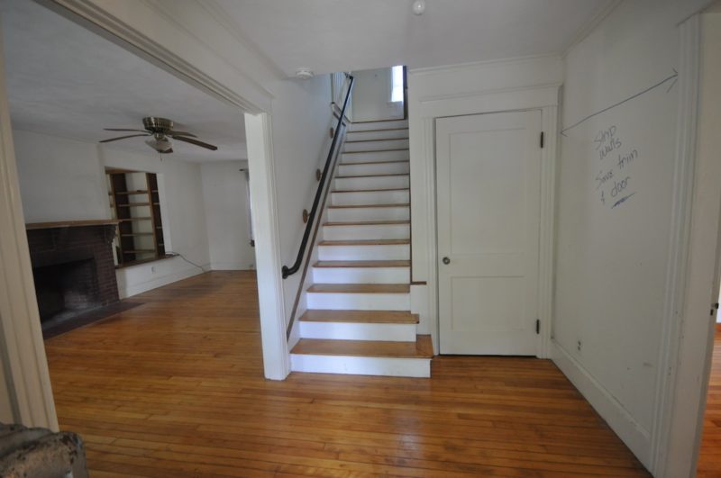 Entry with staircase before remodel
