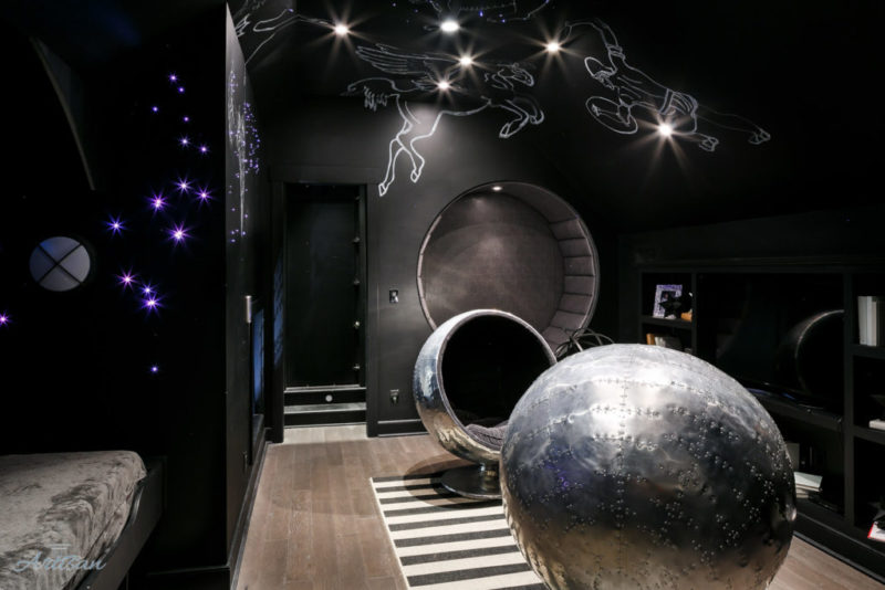 Black-painted playroom with stars on ceiling