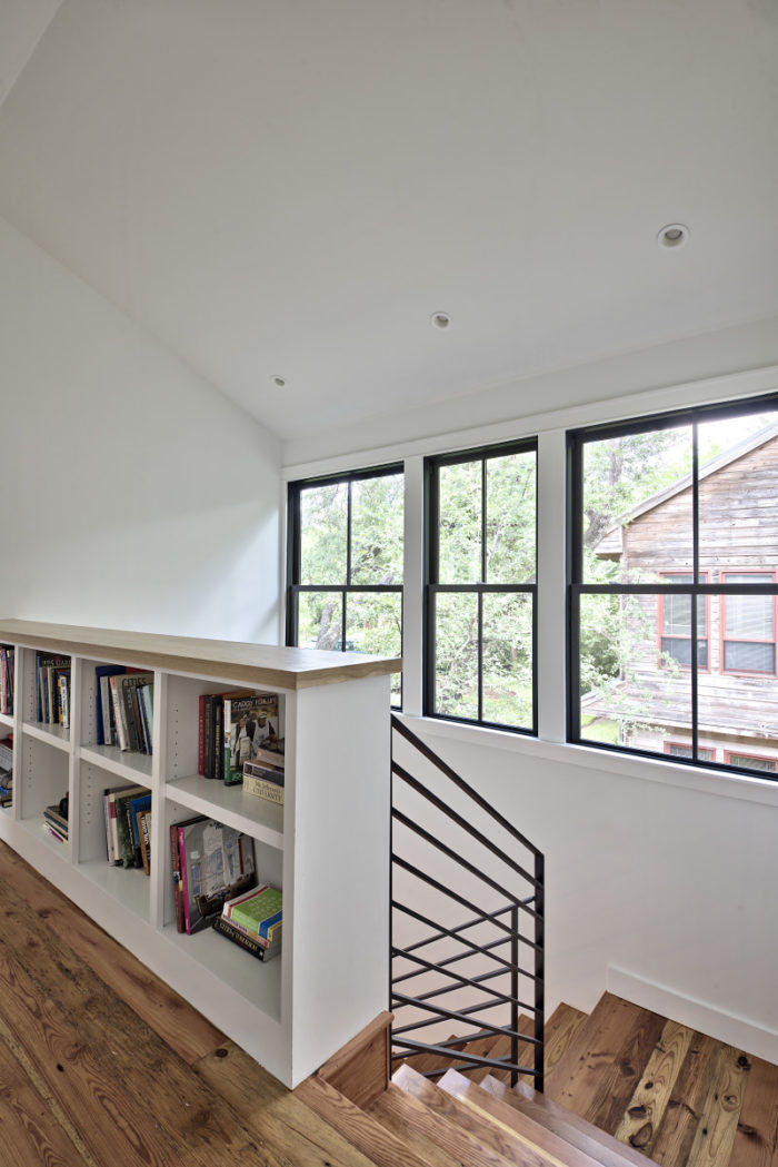 Upstairs landing with built-in book cubbies beneath ledge