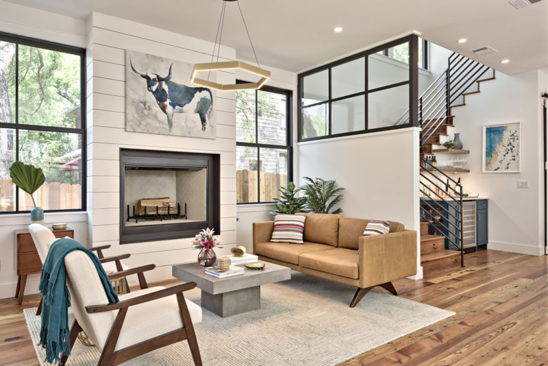 A living room filled with furniture and a large window