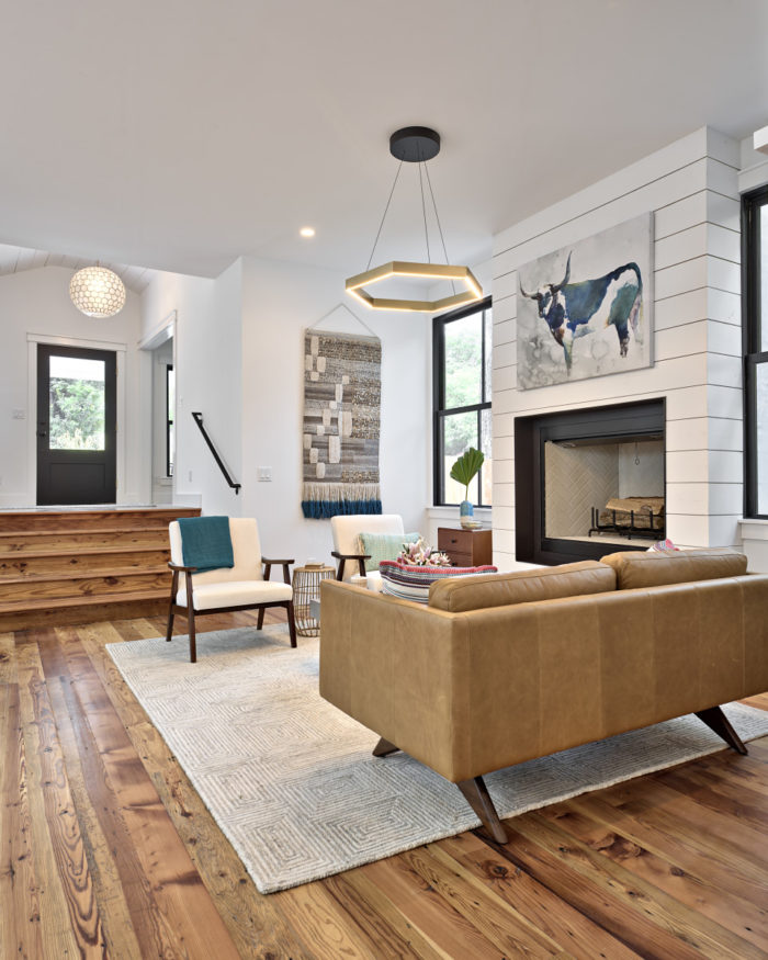 A living room filled with furniture and a fire place