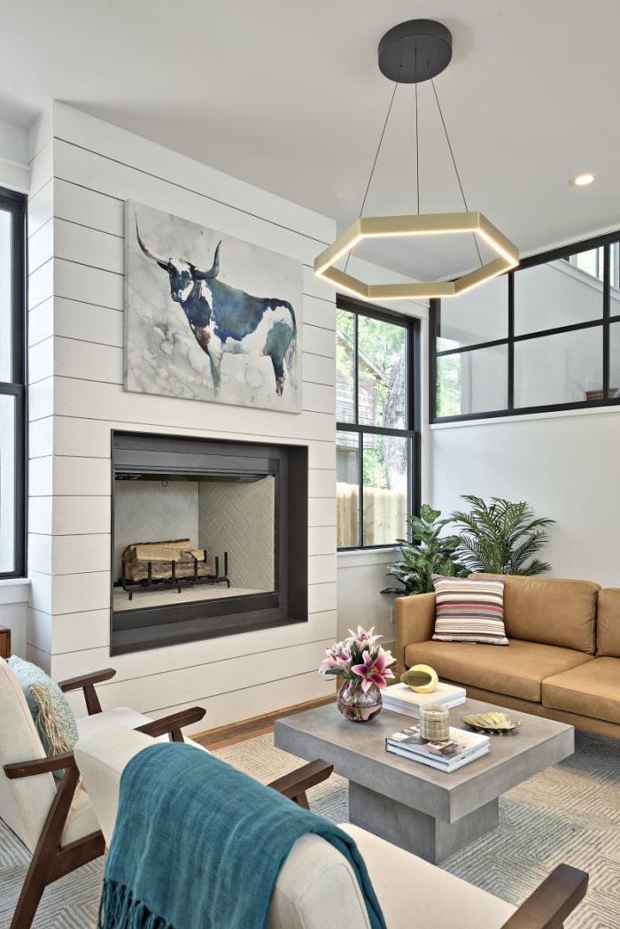 A living room filled with furniture and a fireplace