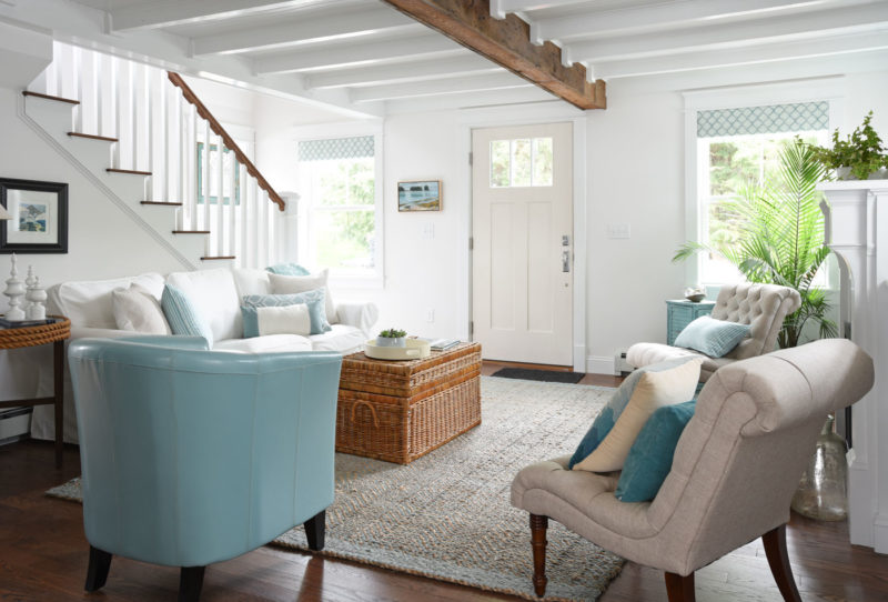 A living room filled with furniture and a large window