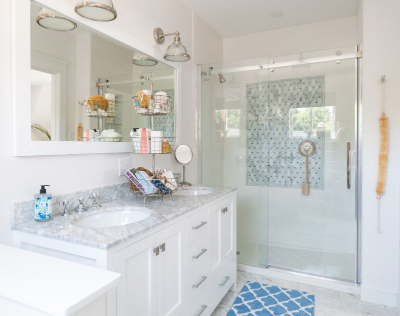 Bathroom with dual sinks and shower