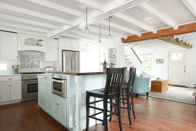 Kitchen island with black bar stools