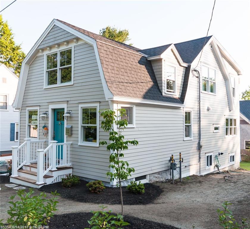 Front exterior of house with teal blue door