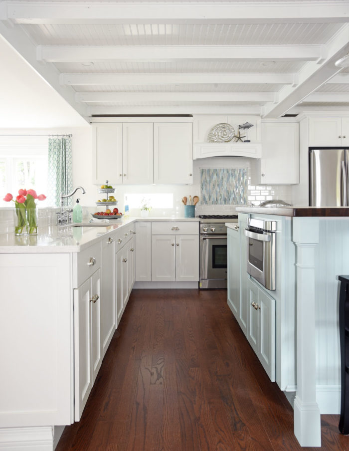 A kitchen with a wood floor