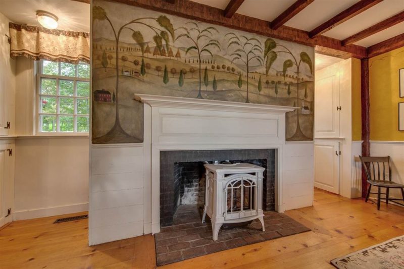 Fireplace with mural over mantel