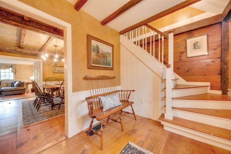 Entry hall of antique cape with staircase